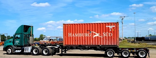 Dedicated Freight Solutions - Image of Truck with Container Loaded on It